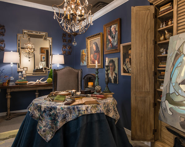 blue walls with various art pieces, table cloth, old style